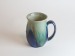 Salt-fired face mugs