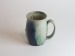 Salt-fired face mugs