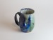 Salt-fired face mugs