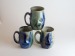 Salt-fired face mugs