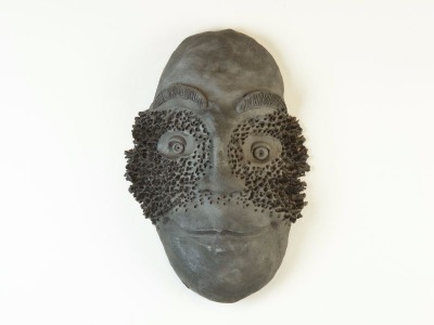 Pit-fired mask